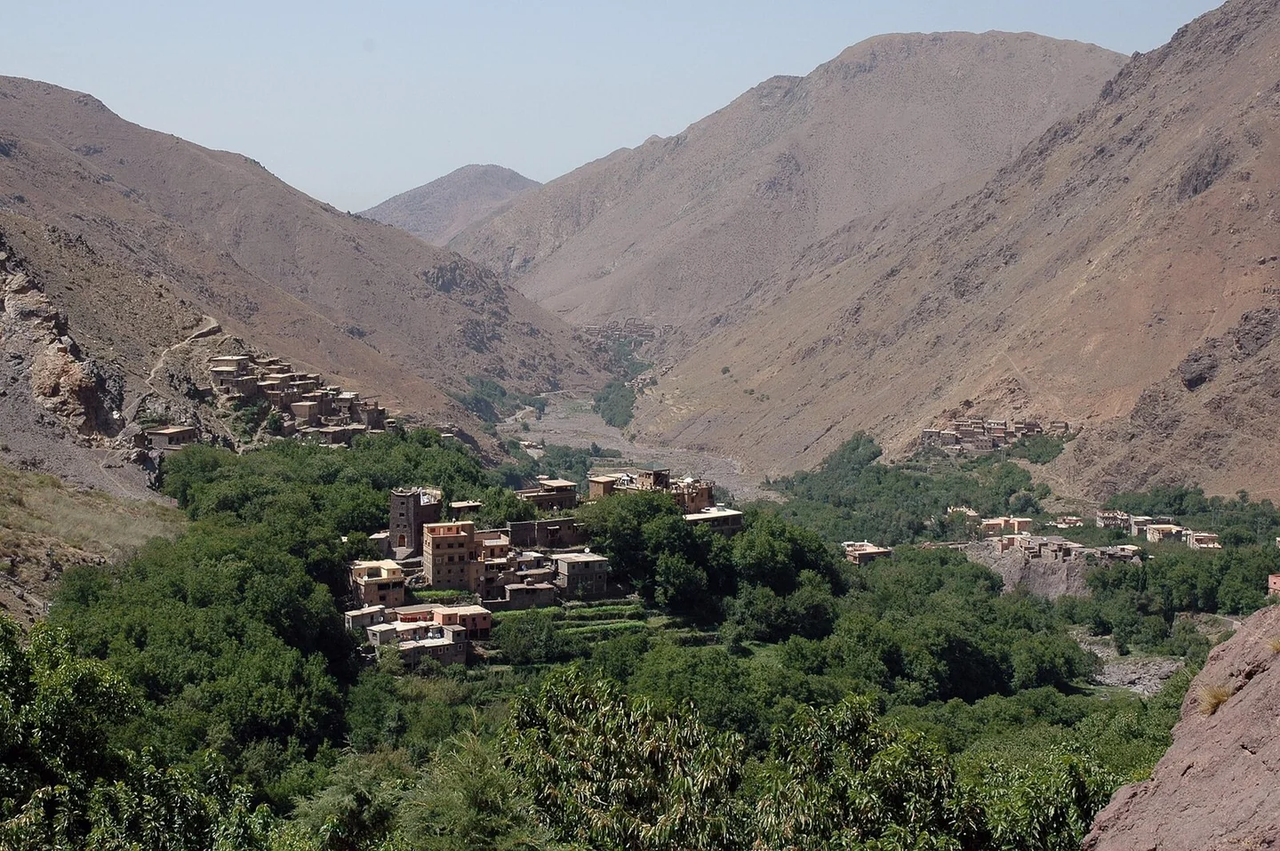 Green High Atlas valley near Imlil with snow on the peaks, Morocco in April